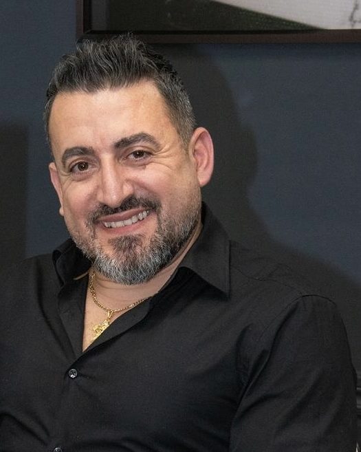 Nidal, barber at Khalil Barbershop